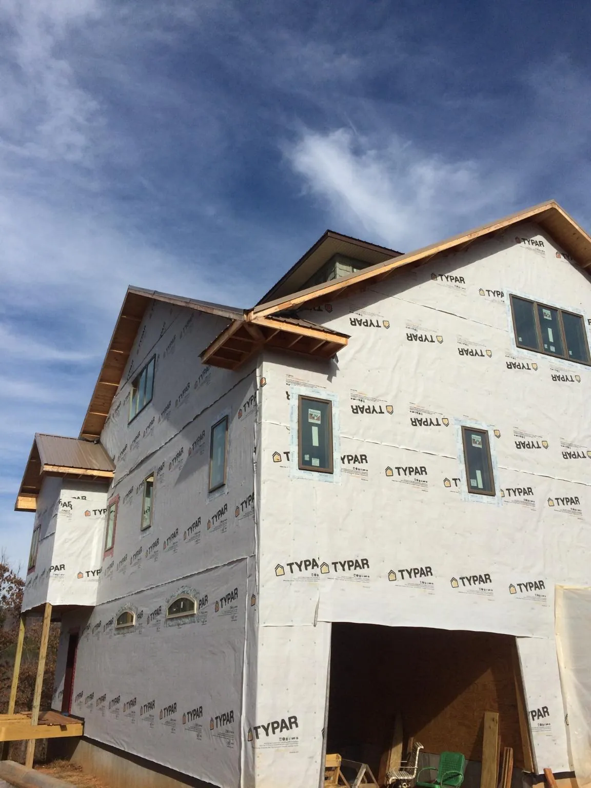 Stick built house wrapped in Typar with new roof framing and dormers in Turbotville
